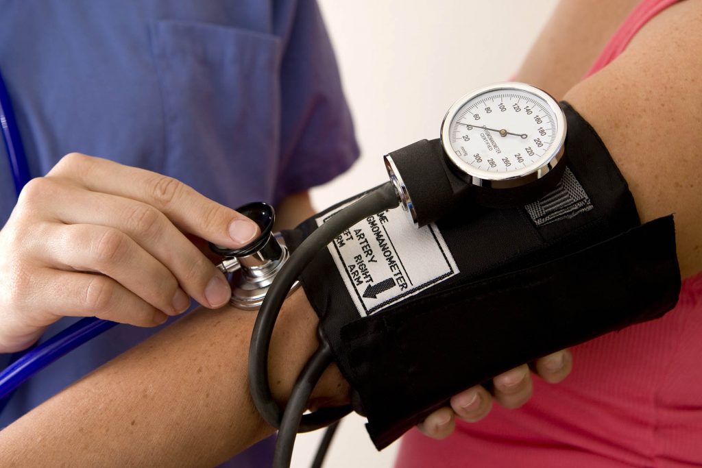 Doctor or nurse taking a patient’s blood pressure Blood Pressure